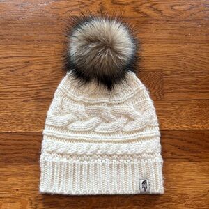 The North Face Women’s Cream Cable-Knit Beanie with Faux Fur Pom